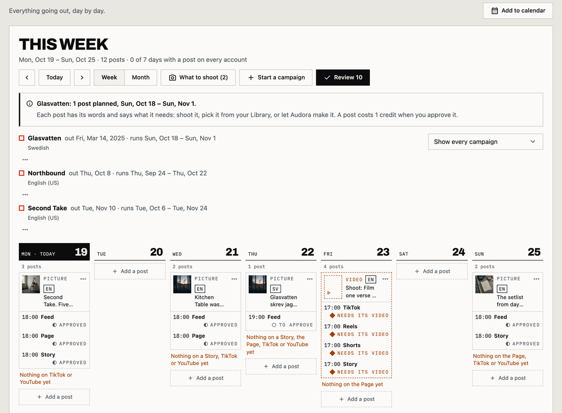 Audora's Promo calendar on a demo account, this week: three releases' campaigns on one calendar, each with its language, and Week and Month, What to shoot, Start a campaign and Review over it; each day's posts with their picture, time, account (Feed, Page or Story) and state, approved or to approve, and what each day still lacks; Add a post on every day