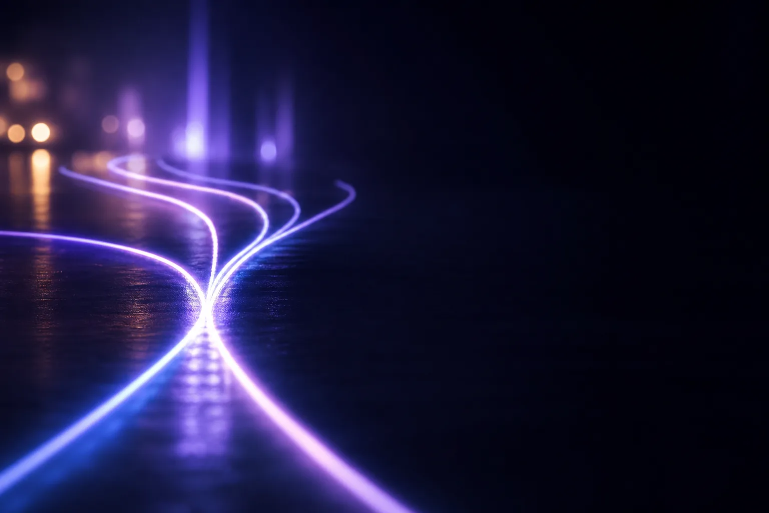 A single trail of light on a dark road splitting into several diverging paths, one fading out